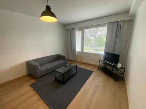 Et opholdsområde på Spacious Apartment for 4 with Sauna