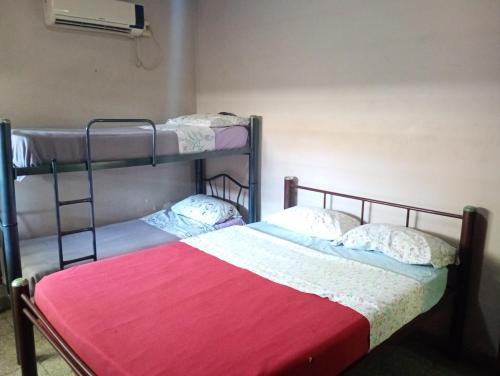 Cama o camas de una habitación en Hostel Trotamundos