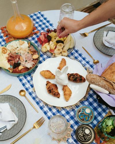 a table with a plate of food on it at Ca Sana Teulada Moraira, Grupo Terra de Mar, alojamientos con encanto in Moraira