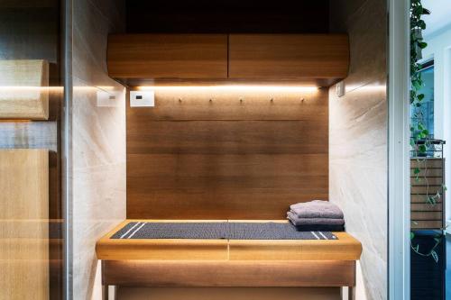 a sauna is shown with a wooden wall at Stay North - Kukkula in Västerskog