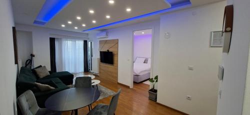 a living room with a couch and a table at Extra Apartman Palata in Banja Luka