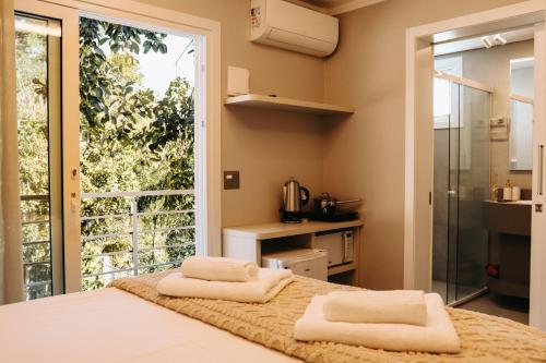 Ένα ή περισσότερα κρεβάτια σε δωμάτιο στο Alma do Vale Hospedaria