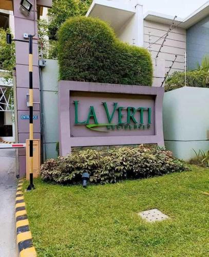 a sign for a la viniera hotel at 1BR LaVerti Cloud Nine Suite Family Affordable Staycation in Manila