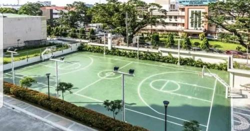 a tennis court in the middle of a city at 1BR LaVerti Cloud Nine Suite Family Affordable Staycation in Manila