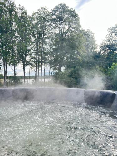 a river with smoke coming out of it at Aframe Shanti DreamDim in Svityazʼ