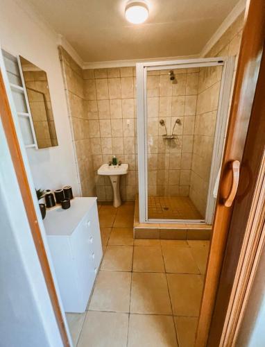 a bathroom with a shower and a sink at 4 Jooste Street in Windsor Park