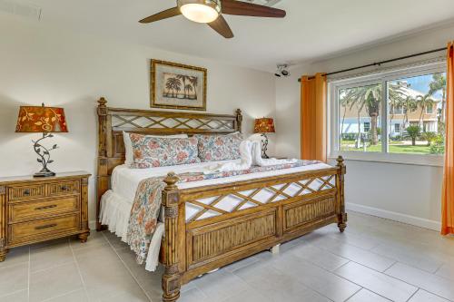 a bedroom with a bed and a window at Waterfront Retreat with Boat Dock and Yard in Ft Myers in Iona