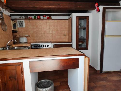 a kitchen with a sink and a stove at Casa di Tatiana in Senigallia
