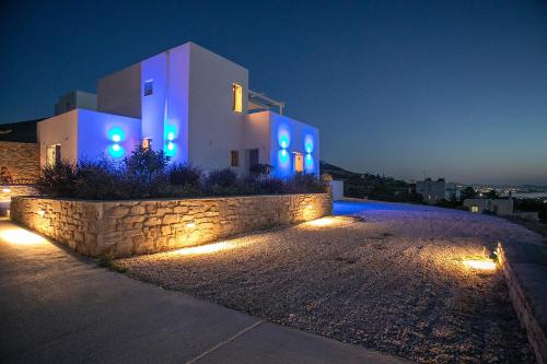 a building with blue lights on it at night at Galanos villa in Krotiri