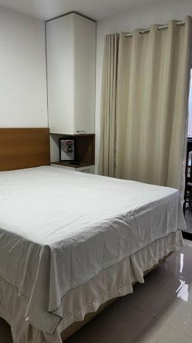 En eller flere senge i et værelse på Apartamento- studio