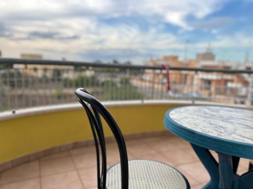 a blue table and chairs on a balcony at Costa Doro - Ristorante Hotel in Salve