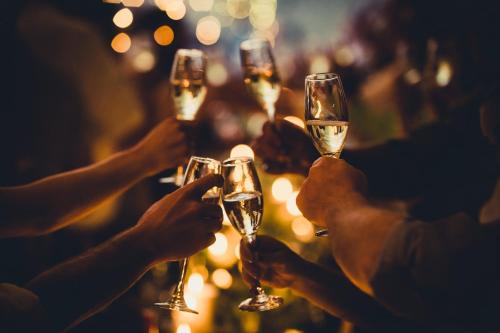 a group of people holding up wine glasses at Hotel Bristol Berlin in Berlin