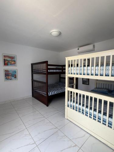 a room with two bunk beds in a room at Ocean Majesty in Playa Blanca