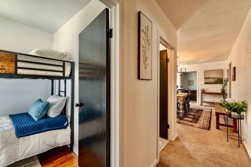 a bedroom with a bunk bed and a hallway at 17 Min to NRG | Grill | Huge Yard | Private | Cozy in Oak Hill