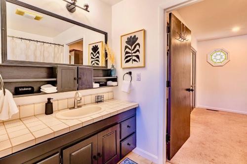 a bathroom with a sink and a mirror at 17 Min to NRG | Grill | Huge Yard | Private | Cozy in Oak Hill