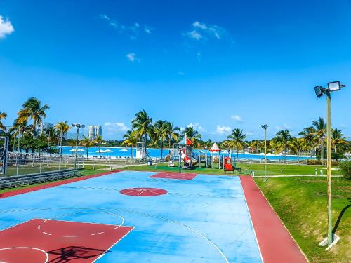 a basketball court on the beach with palm trees at Ocean Majesty in Playa Blanca