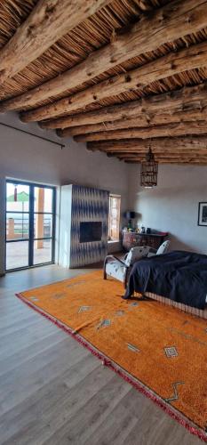 a living room with a couch and a rug at Dar Imiri in Ourika
