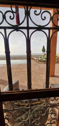 a view of a beach through a iron gate at Dar Imiri in Ourika