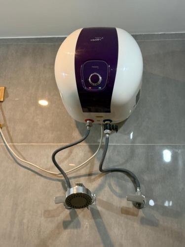 a hair dryer sitting on top of a glass table at OM LINGESWARAN HOME STAY Tiruvannamalai in Tiruvannāmalai