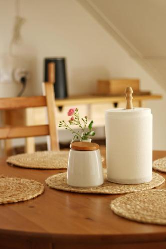 a table with a candle and plates on it at Penzion Dvůr in Obora