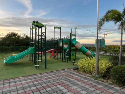 a playground with a slide in a park at Spacious Studio CondoinClark!FreeParking! in Fort Stotsenburg