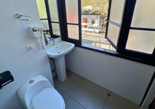 a bathroom with a toilet and a sink at The Hostel Santiago in Santiago