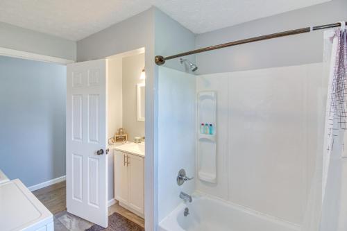a bathroom with a shower and a sink at 7 Mi to Barren River Lake Quiet Getaway with Yard! in Lucas