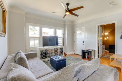 a living room with a couch and a ceiling fan at 1 Mi to Dimond District Oakland Home with Deck in Canyon