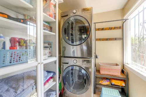 a laundry room with two washer and dryer at 1 Mi to Dimond District Oakland Home with Deck in Canyon