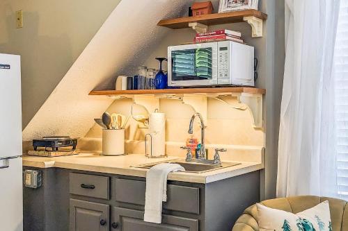 a kitchen with a sink and a microwave at Cozy Ludlow Escape in Ludlow