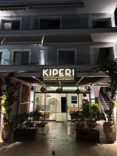 a restaurant with a sign on the front of a building at Kiperi Exclusive in Parga
