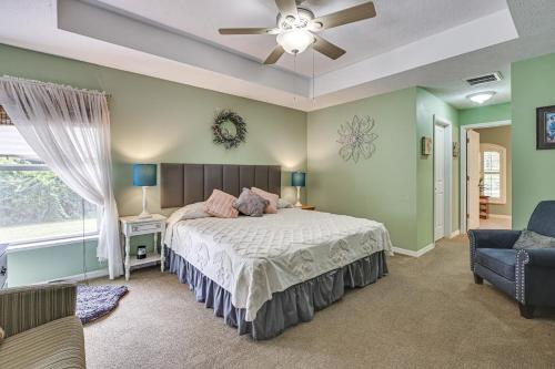 a bedroom with a bed and a ceiling fan at Dog-Friendly Home, Lake Henderson Across Street! in Inverness