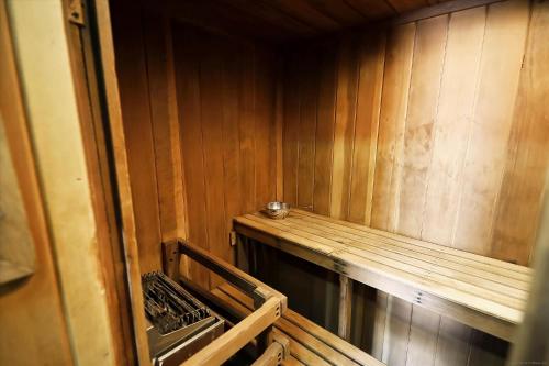 a room with a wooden wall and a wooden shelf at Notchbrook 5 Apt. in Stowe