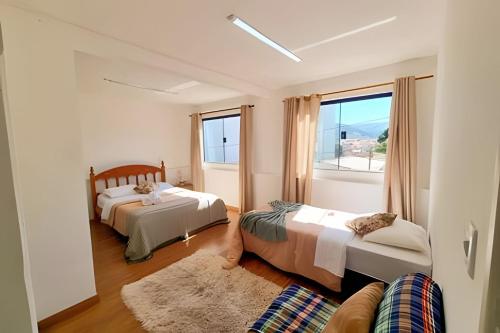 Ένα ή περισσότερα κρεβάτια σε δωμάτιο στο Família Costa-Studio Marie Curie (Inatel)