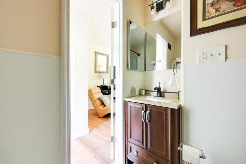 a bathroom with a sink and a mirror at Close to Hospitals Peaceful Birmingham Studio in Wisteria Commons