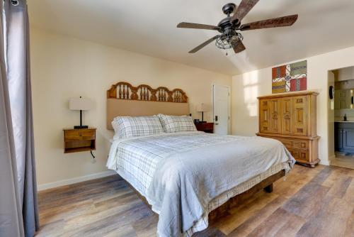 a bedroom with a bed and a ceiling fan at 6 Mi to the Summit Stylish Apt with Patio Access in Wisteria Commons