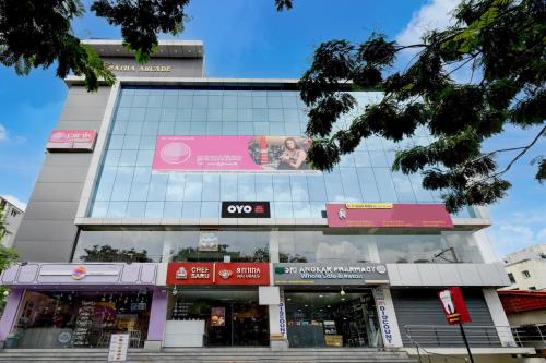 a building with a sign on the side of it at SPOT ON Sriman Stay Inn in Hakīmpet