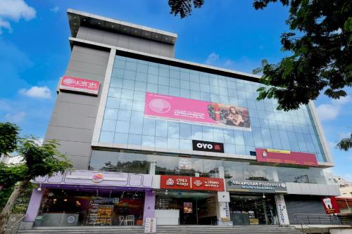 a building with a sign on the side of it at SPOT ON Sriman Stay Inn in Hakīmpet