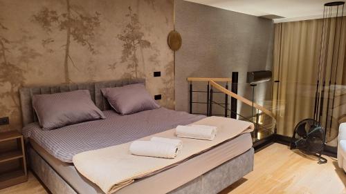 Ένα ή περισσότερα κρεβάτια σε δωμάτιο στο Apartament Premium z jacuzzi nad Zegrzem