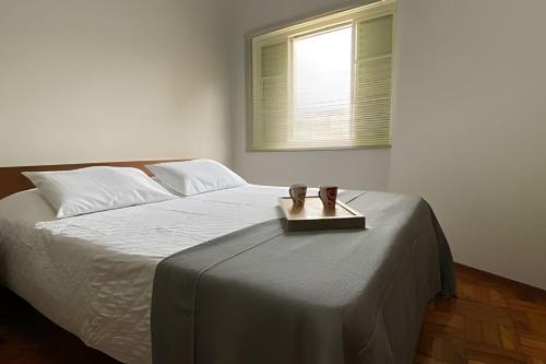 Кровать или кровати в номере Família Costa-Apê no centro