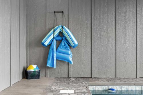 a blue towel is hanging on a wall at Mountain Waters - Pool Theater & Views in Sevierville