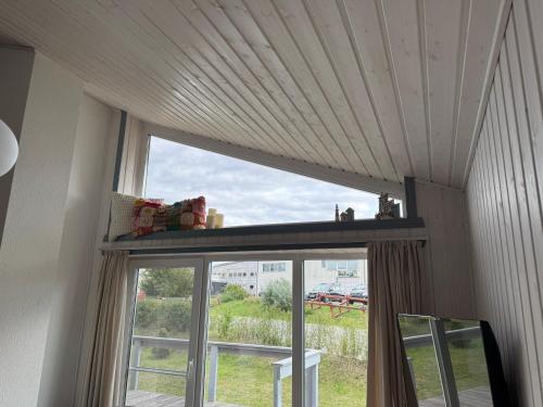 a window in a room with a view of a field at Seeschwalbe 78 Kompassweg in Rechlin