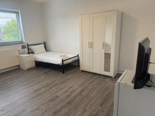 Ένα ή περισσότερα κρεβάτια σε δωμάτιο στο Apartment 20qm Prisdorf