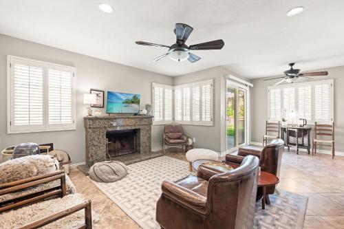 a living room filled with furniture and a fireplace at Near ONT Spacious Designer-Style Family Retreat in Guasti