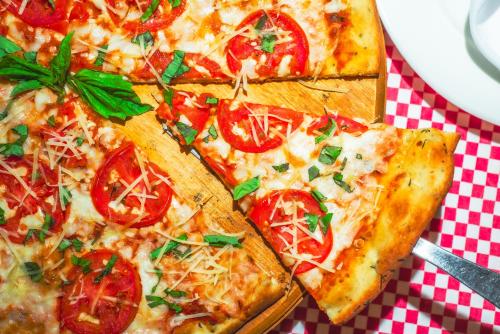 a group of slices of pizza on a table at Hotel Santa Fe Loreto by Villa Group in Loreto