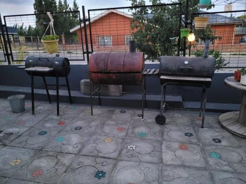 an outdoor area with two musical instruments on a patio at CABAÑAS RINCON SOLEADO, Chile Chico in Chile Chico