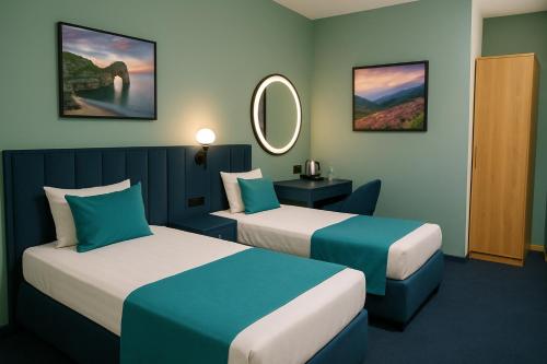 Katil atau katil-katil dalam bilik di Royal Inn Hotel
