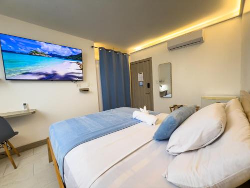 Postel nebo postele na pokoji v ubytování Libertad 109 Hotel