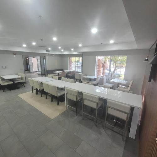 a large room with a large table and chairs at Wingate By Wyndham Mansfield Ontario in Mansfield