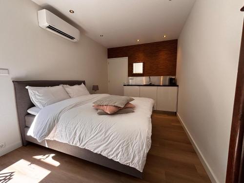 Ένα ή περισσότερα κρεβάτια σε δωμάτιο στο Guesthouse Mamaloutje